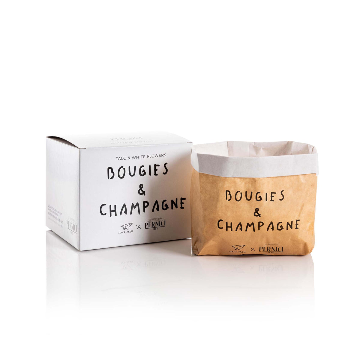Candela profumata particolare “Pensieri Stropicciati – talc & white musk bougie e champagne in still life.